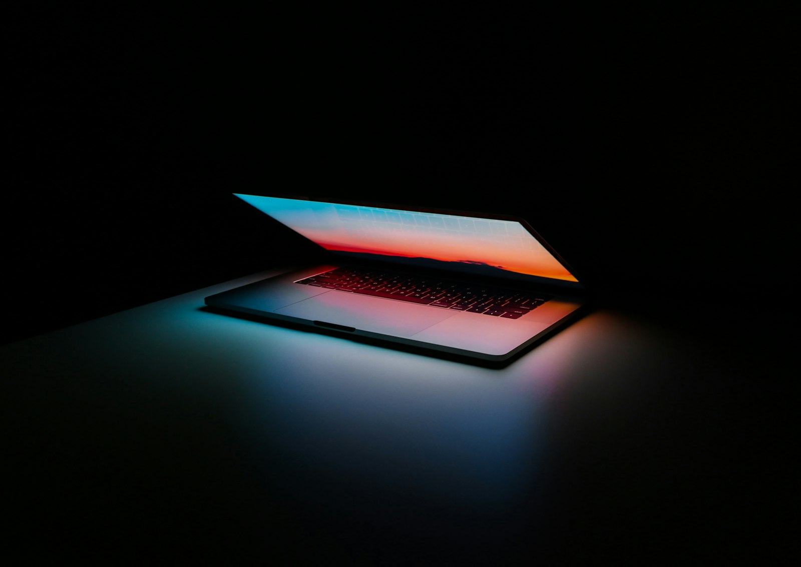 Professional workspace with AI research displayed on a monitor